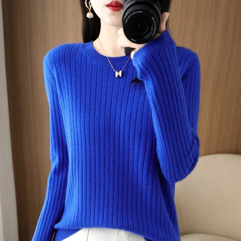 Cozy royal blue ribbed pullover with a crewneck, modeled with a stylish relaxed fit and subtle texture.