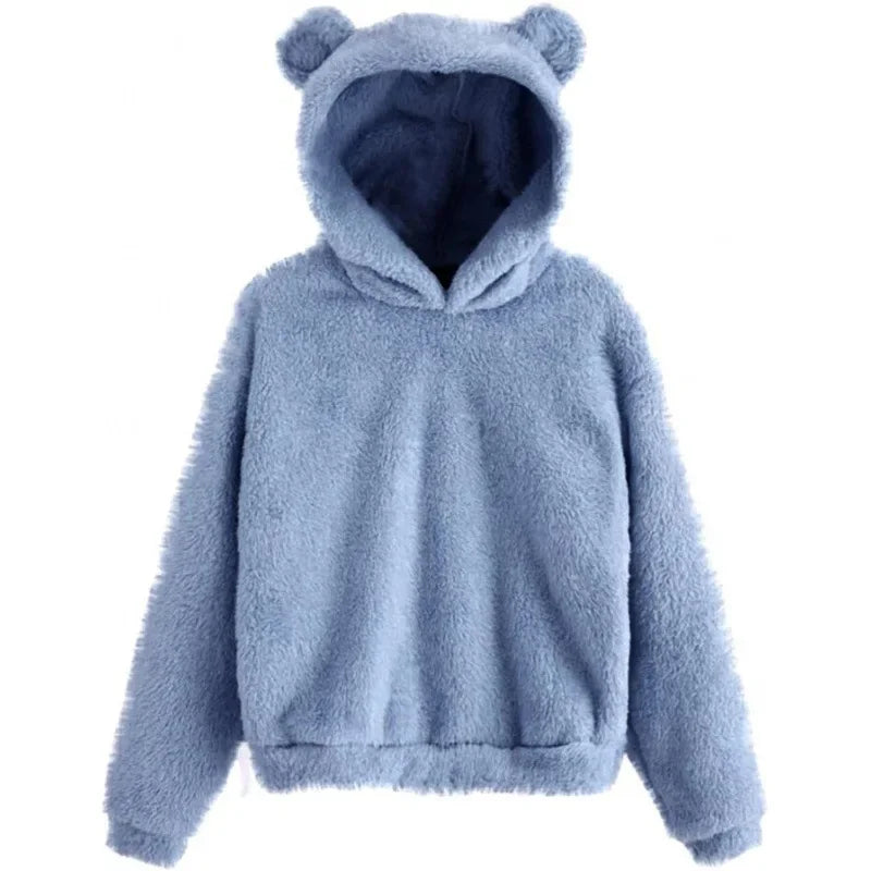 Cozy oversized blue hoodie made from plush fleece featuring bear ears on the hood and ribbed hem.
