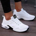 White LOVORA™ Aura Air Boost Platform Sneakers featuring breathable mesh and a transparent air-cushion sole, worn with black leggings.