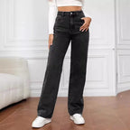 High-waisted, wide-leg jeans in a solid black wash, paired with a fitted white crop top and white sneakers.