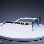 Rimless square sunglasses with gradient blue lenses, gold-tone metallic accents, and stylish black-and-white patterned temples.