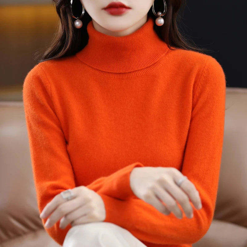 Bright orange LOVORA™ Premium Merino Wool & Cashmere turtleneck sweater features a high collar and ribbed cuffs.