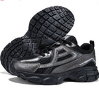 Chunky black and gray LOVORA™ Element 3D Tech Sneakers with a textured sole and breathable mesh panels.