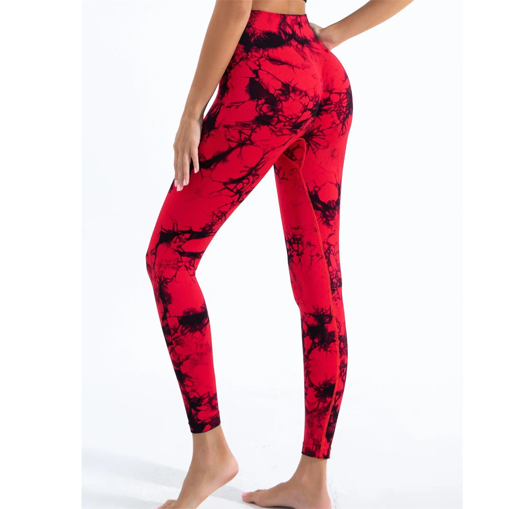 Premium tie-dye seamless scrunch butt leggings in red and black, featuring a high-rise waistband and form-fitting design.