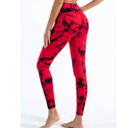 Premium tie-dye seamless scrunch butt leggings in red and black, featuring a high-rise waistband and form-fitting design.