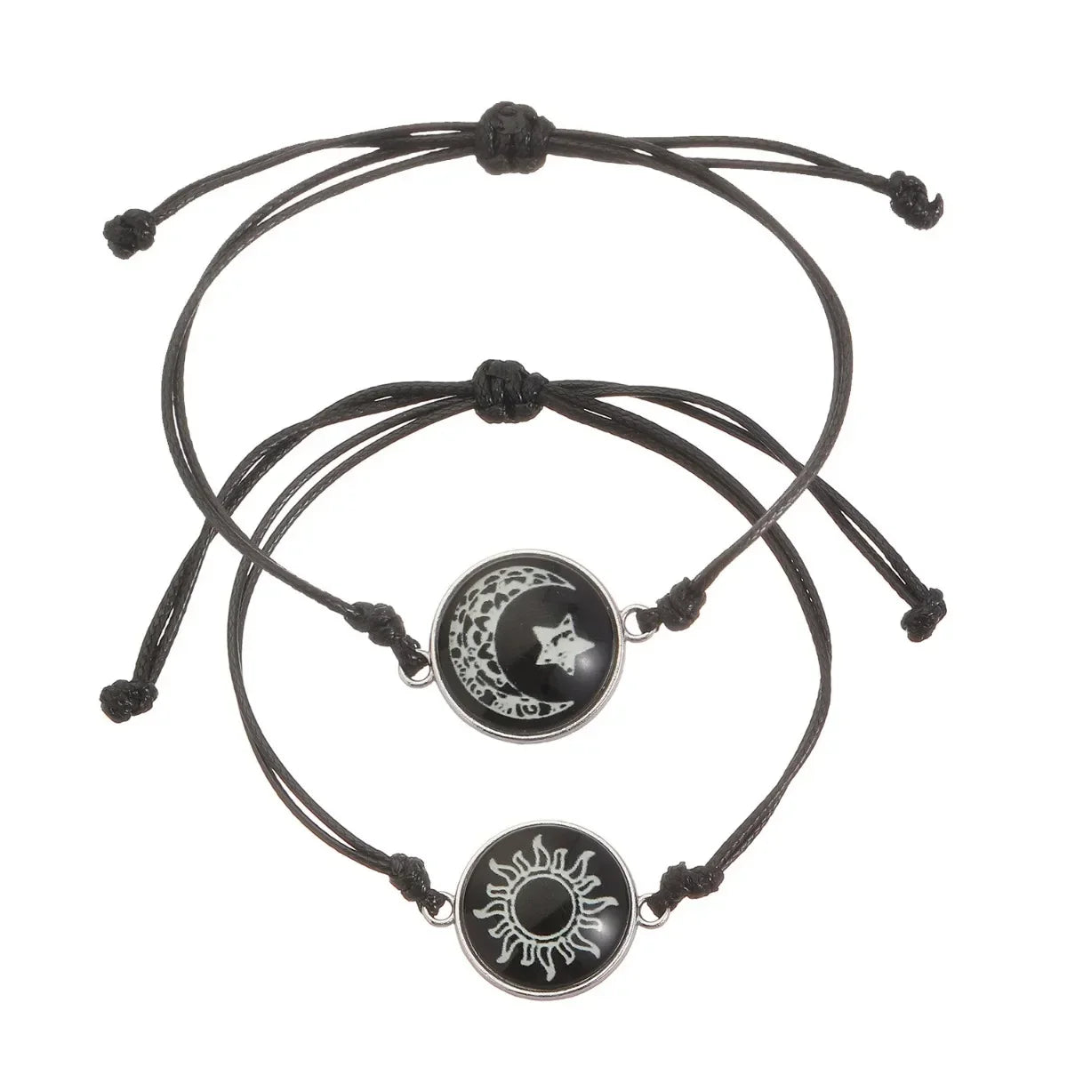 Two minimalist black rope bracelets featuring a sun and moon emblem, with adjustable sliding knots for a custom fit.