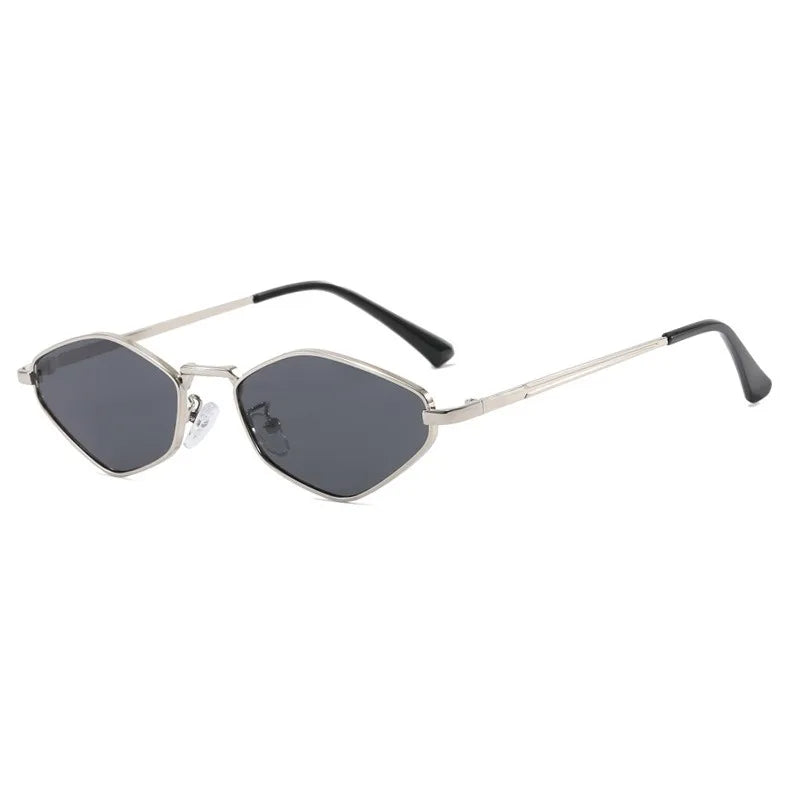 Diamond-cut polygonal sunglasses featuring a rimless design, metallic frame, and dark tinted lenses.