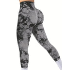 Premium tie-dye leggings in black and gray feature a high-rise waist and scrunch butt design, showcasing a close fit.