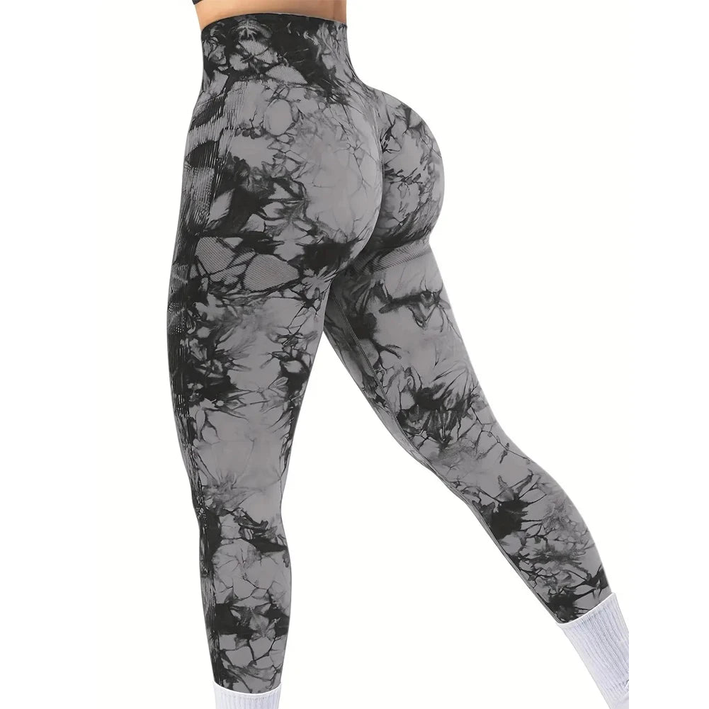 Premium tie-dye leggings in black and gray feature a high-rise waist and scrunch butt design, showcasing a close fit.