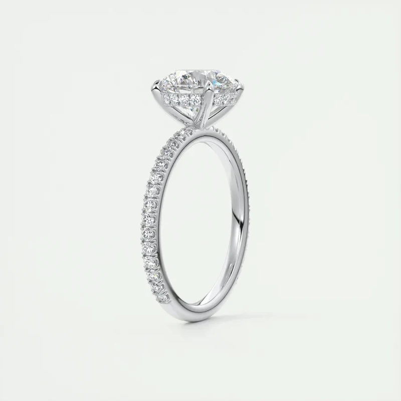 Sterling silver ring featuring a round-cut 2 carat moissanite stone, set in a six-prong design with a sparkling band.