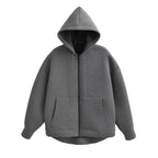 Gray oversized zip-up hoodie with a double-lined hood, drop shoulders, and front kangaroo pockets.