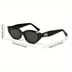 Chunky black cat-eye sunglasses with dark lenses, featuring a sculpted frame and stylish side detailing.