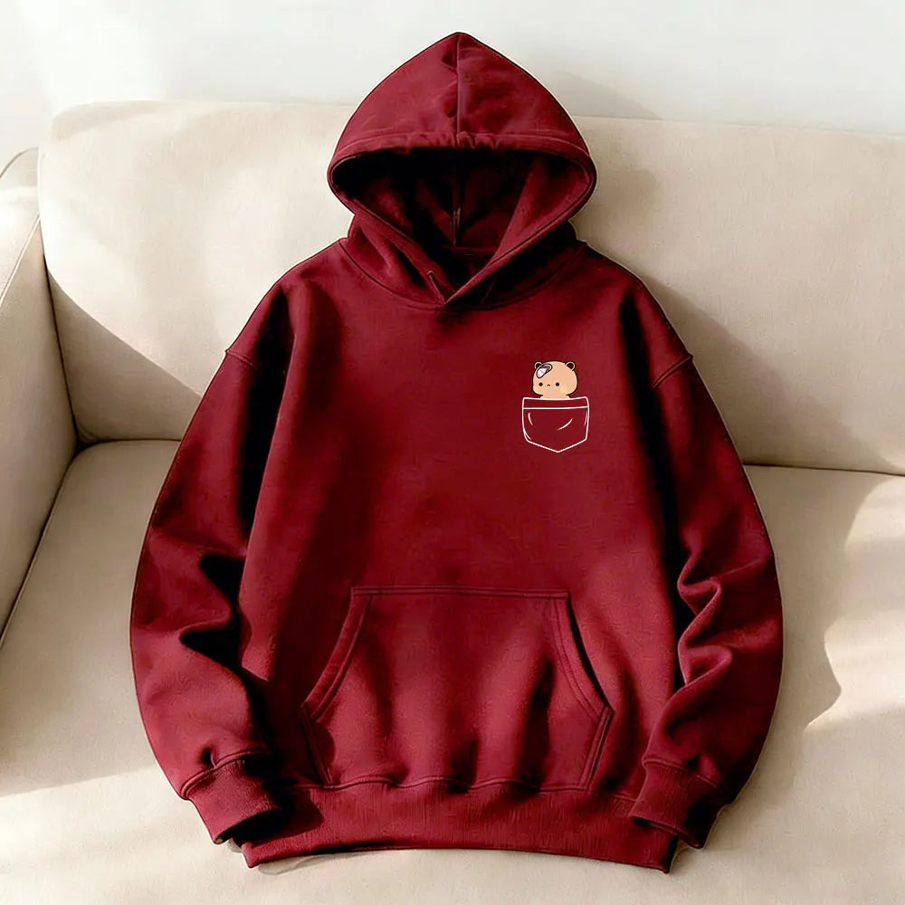 Burgundy oversized hoodie featuring a cute bear graphic in the pocket, with a kangaroo front pocket and a cozy hood.