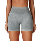 High-waisted, seamless gym shorts in a soft grey sand-washed texture, offering a fitted, sculpting design.