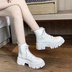 Chunky white LOVORA™ Combat Matrix platform boots with lace-up front and textured sole, worn with bare legs.
