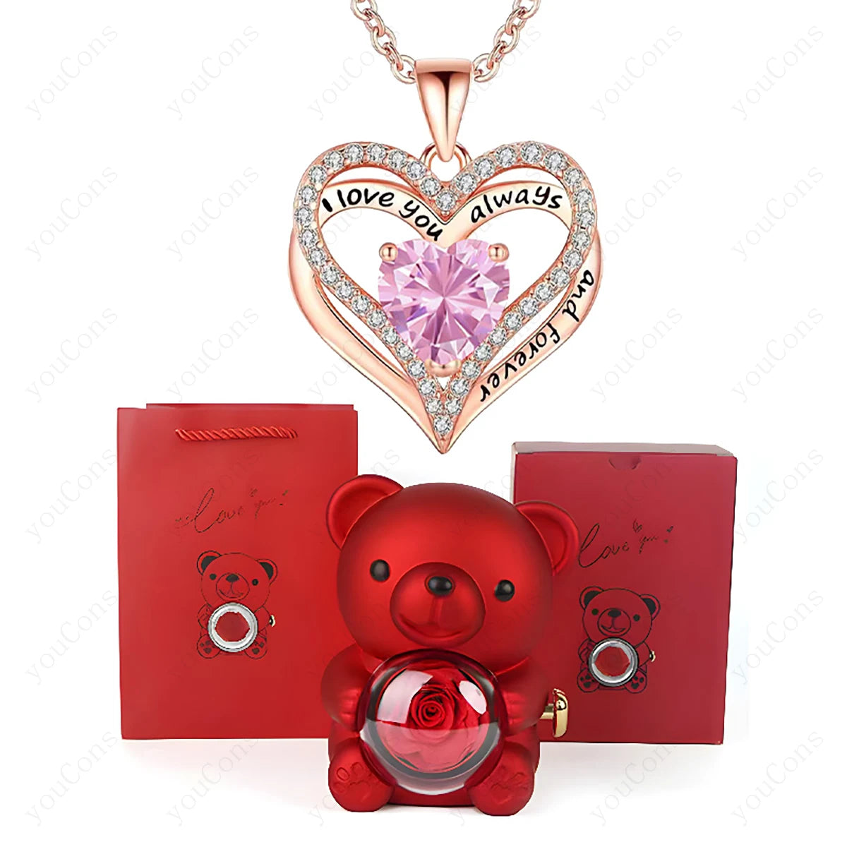 Luxury heart necklace set featuring a pink heart-shaped pendant with a diamond-like border, a red teddy bear, and a gift bag.