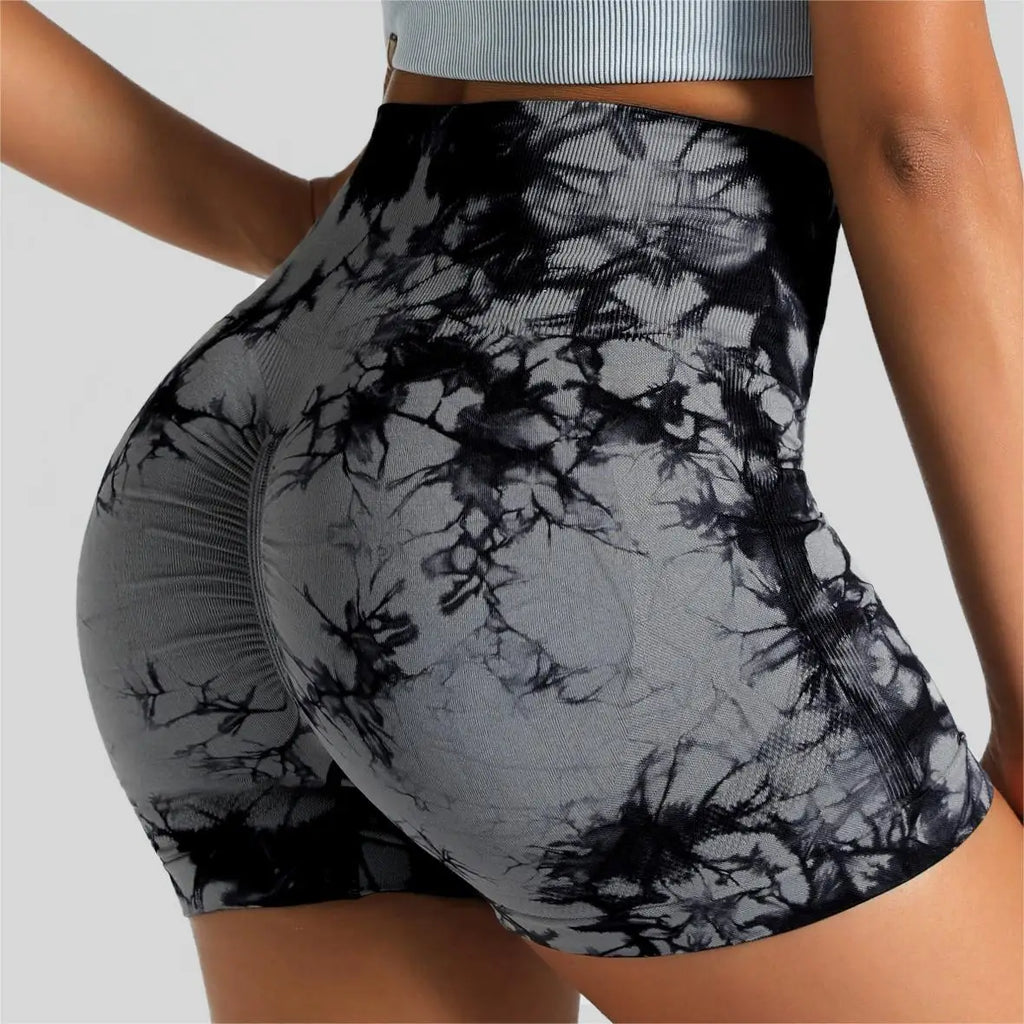 High-waisted seamless gym shorts in black and grey tie-dye, featuring a scrunch butt lift design and wide waistband.
