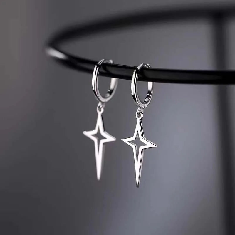 Silver gothic star drop earrings with a hollow design and hoop attachments, showcasing a bold punk aesthetic.