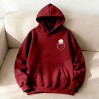 Burgundy oversized hoodie featuring a bear graphic in a pocket, with a kangaroo front pocket and soft fleece material.
