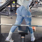 High-waisted, seamless leggings in light blue with a cloud pattern, offering a fitted, supportive look for workouts.