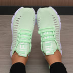 Light green LOVORA™ Aura breathable knitted performance sneakers with a flexible lace-up design and a ventilated, elastic knit upper.