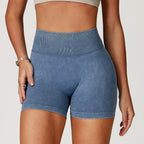 High-waisted, sand-washed gym shorts in a soft blue hue, featuring a ribbed waistband and a body-sculpting fit.