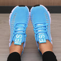 Bright blue knitted performance sneakers with a breathable mesh design, featuring a secure lace-up system and lightweight sole.