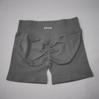 High-waisted, seamless gym shorts in dark gray, featuring a scrunch-butt design and wide waistband for tummy control.