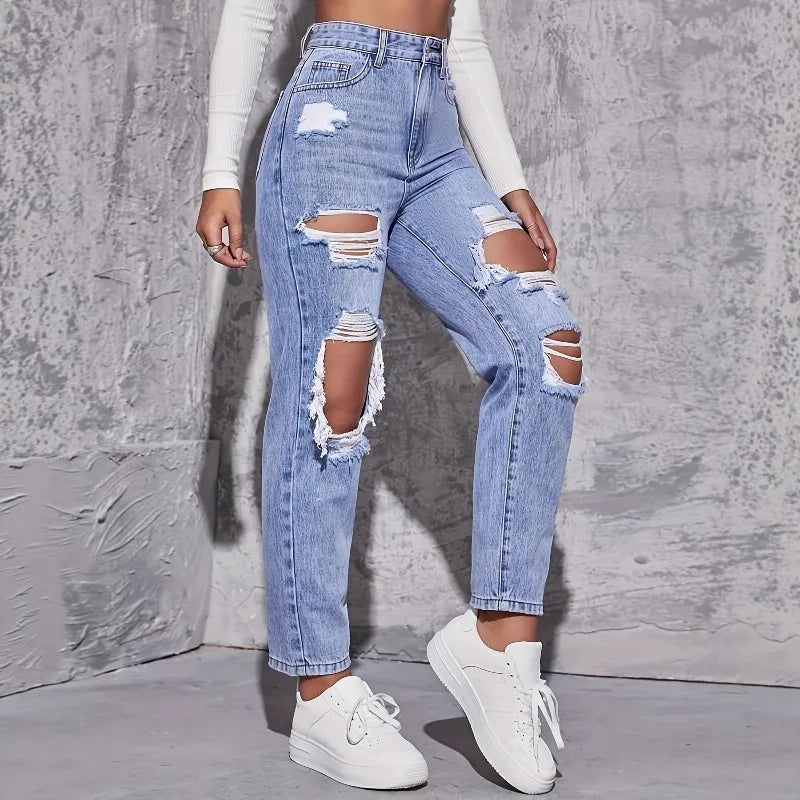 High-waisted light blue distressed straight-leg denim jeans with rips, paired with white sneakers and a fitted top.