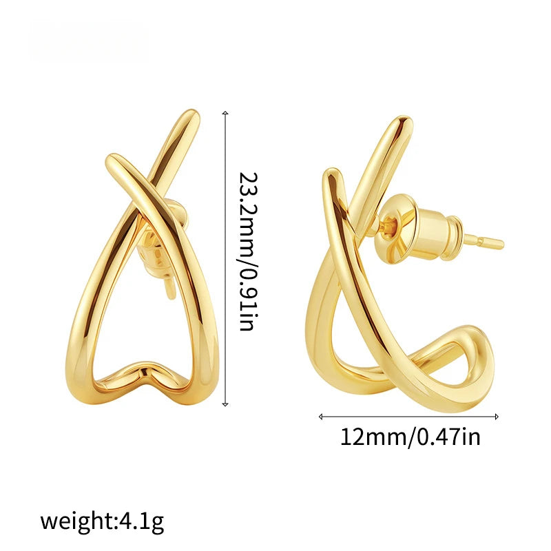 Gold minimalist cross stud earrings with a high-polish finish, featuring a secure butterfly backing for a stable fit.