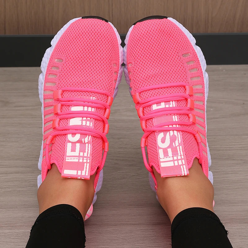 Bright pink LOVORA™ Aura Breathable Knitted Performance Sneakers featuring a slip-on design with a secure lace-up system.