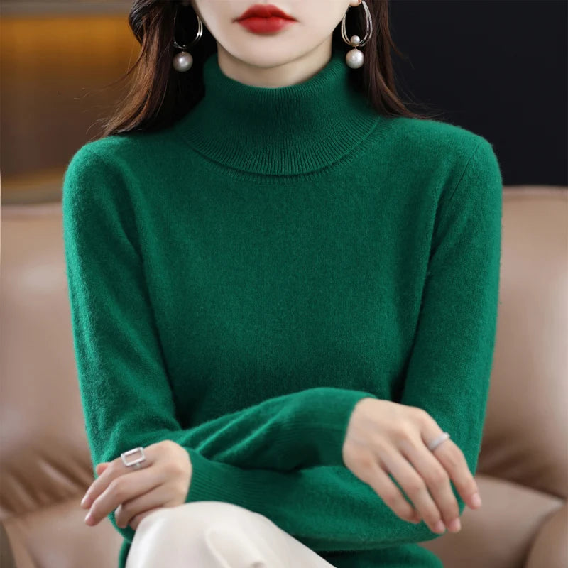Green turtleneck sweater made from a soft merino wool and cashmere blend, featuring a relaxed fit and ribbed cuffs.