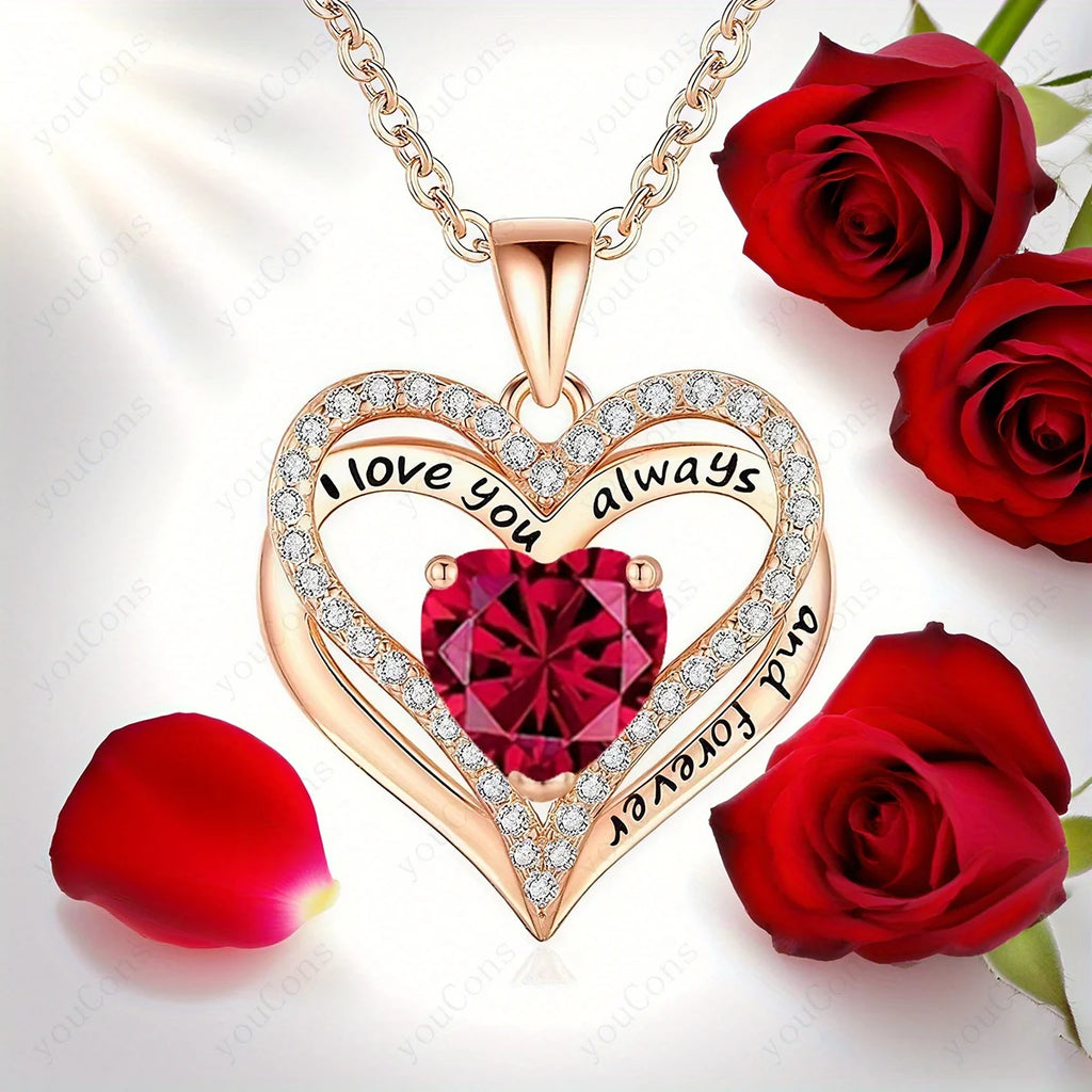 Sculpted rose gold heart pendant necklace with a large red gemstone, surrounded by sparkling accents, and rose petals.