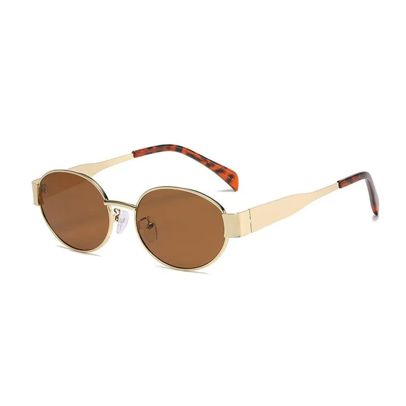 Hexagonal metal sunglasses with brown lenses, gold frame, and tortoiseshell temples. Stylish and sleek design.