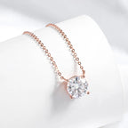 Rose gold 925 pendant necklace featuring a round-cut Moissanite stone in a minimalist setting on a delicate chain.