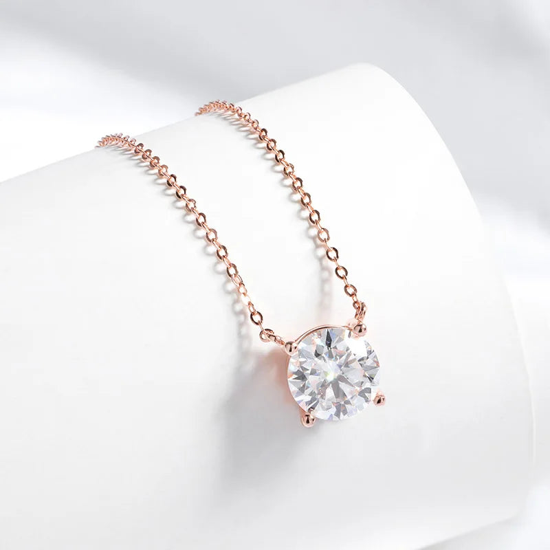Rose gold 925 pendant necklace featuring a round-cut Moissanite stone in a minimalist setting on a delicate chain.