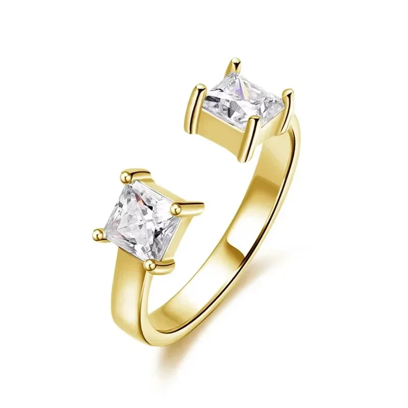 Adjustable LOVORA™ Aura ring in gold, featuring two princess-cut Moissanite stones set in minimalist design.