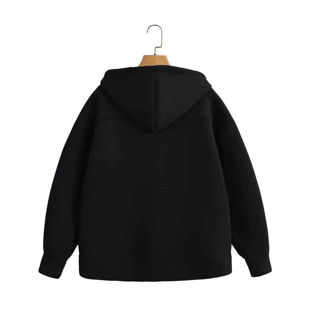 Oversized black hoodie with a double-layered hood, drop-shoulder design, and ribbed cuffs.