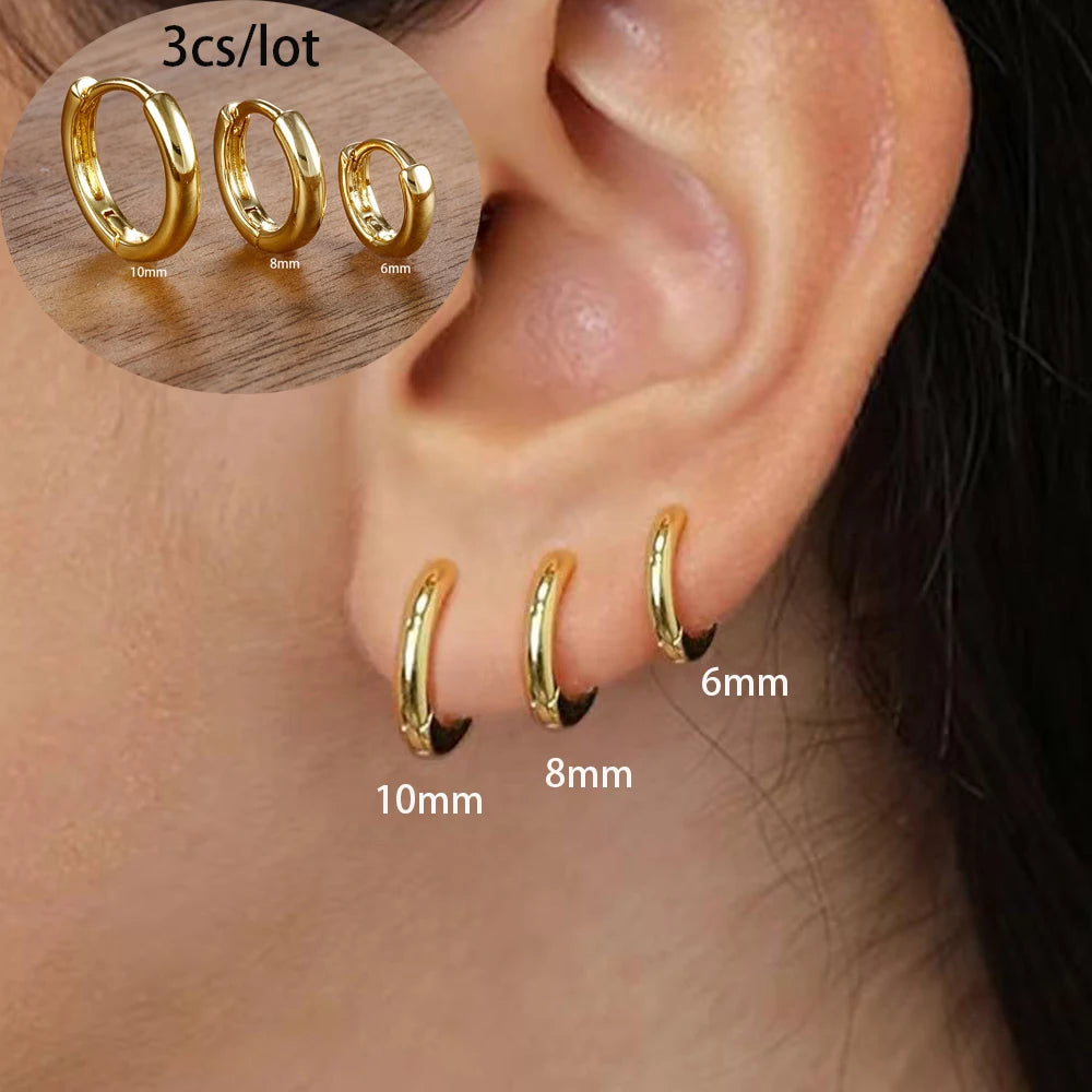 Asymmetric 3-piece earring set in 18K gold plated stainless steel, featuring 10mm, 8mm, and 6mm hoop designs.