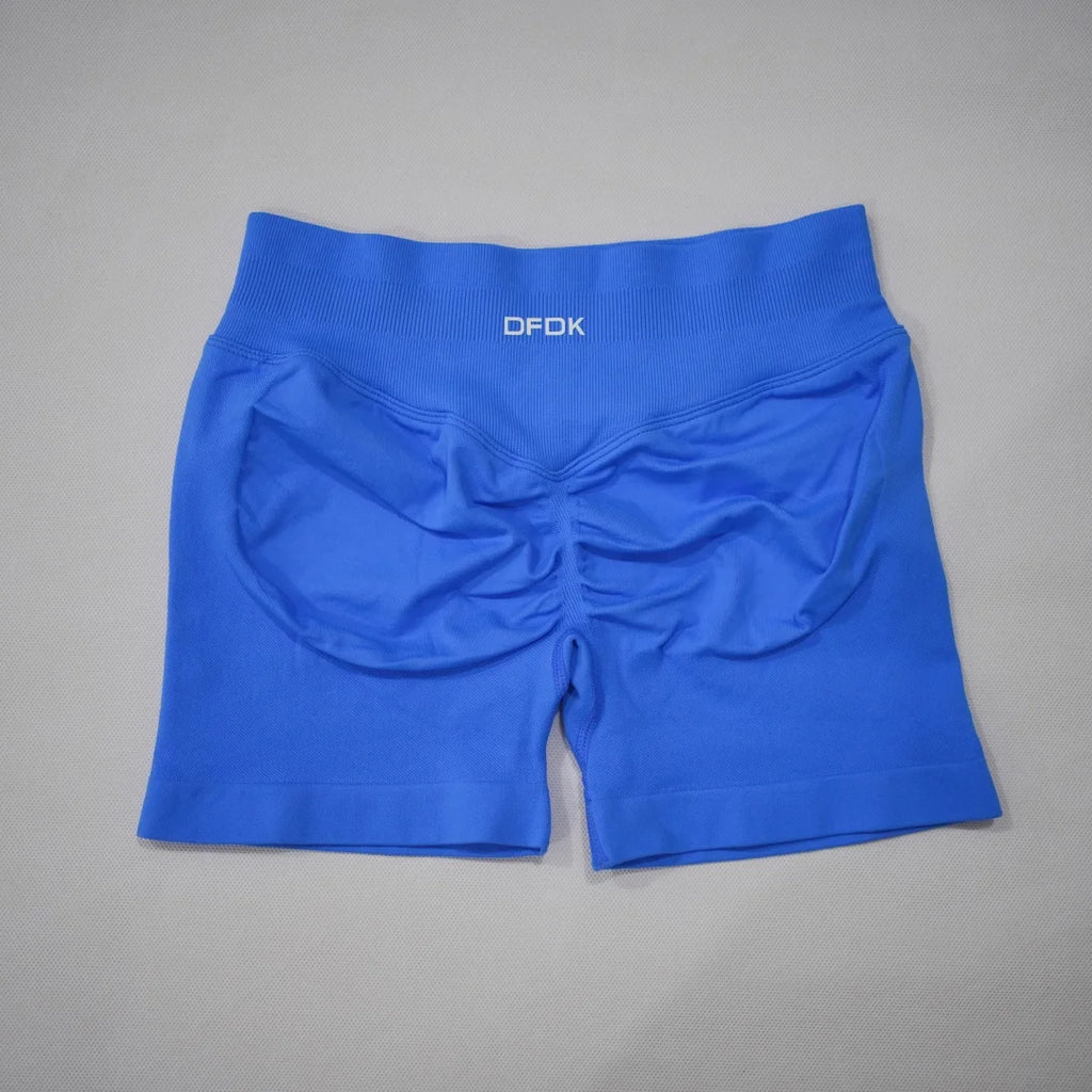 High-waisted gym shorts in bright blue with scrunch-butt design and a wide waistband for secure fit.