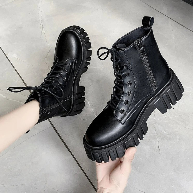 Black LOVORA™ Combat Matrix chunky platform boots with a lace-up front and side zipper, featuring a thick, rugged sole.