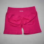 High-waisted gym shorts in a vibrant pink color with a scrunch design and supportive waistband. Lightweight, seamless fit.