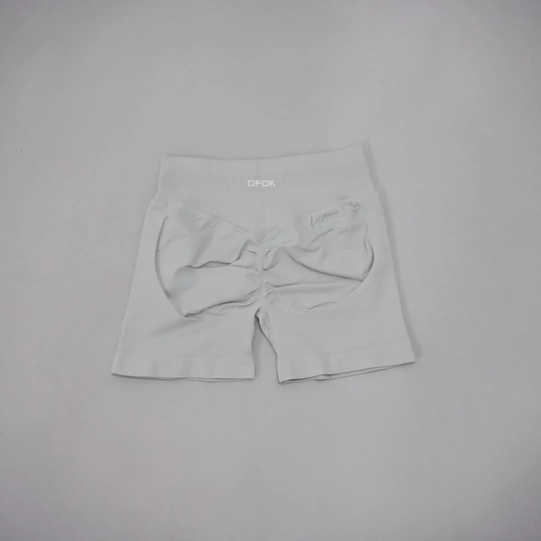 Light gray seamless high-waisted gym shorts with a scrunch-butt design and wide waistband for tummy control.
