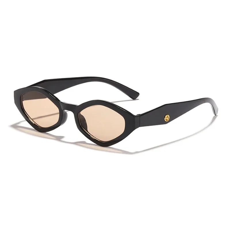Bold cat-eye sunglasses with a high-gloss black frame and light tinted lenses, featuring an edgy, sculpted design.