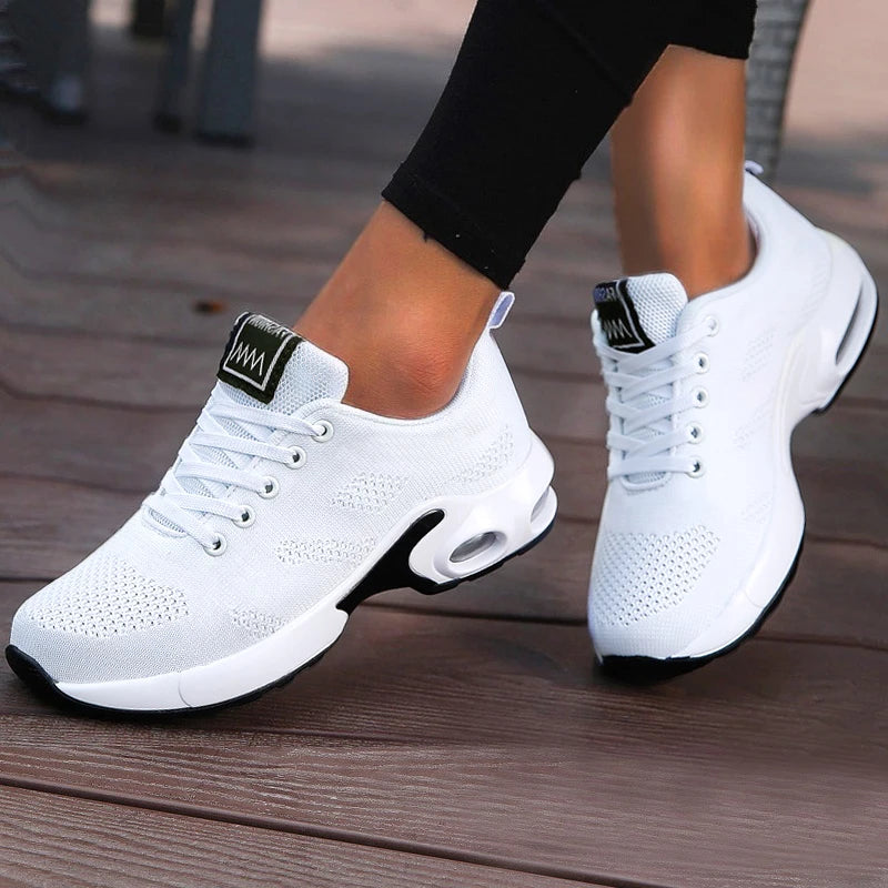 White LOVORA™ Aura Air Boost Platform Sneakers with breathable mesh upper, black outsole, and transparent air-cushion chamber.
