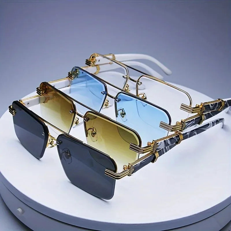 Rimless square sunglasses featuring gradient lenses in black, brown, blue, and yellow, with gold-tone metallic accents.