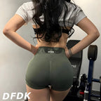High-waisted, olive green gym shorts with a scrunch-butt design, featuring a wide waistband for secure fit and tummy control.