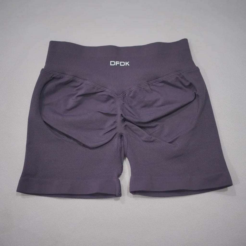 High-waisted gym shorts in a deep mauve color with a scrunch-butt design and wide waistband for comfort and support.