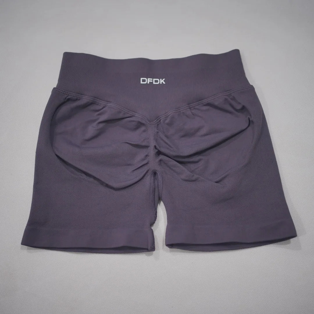 High-waisted gym shorts in a deep mauve color with a scrunch-butt design and wide waistband for comfort and support.