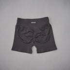 Black high-waisted gym shorts with a seamless design and scrunch-butt detail for a flattering fit.